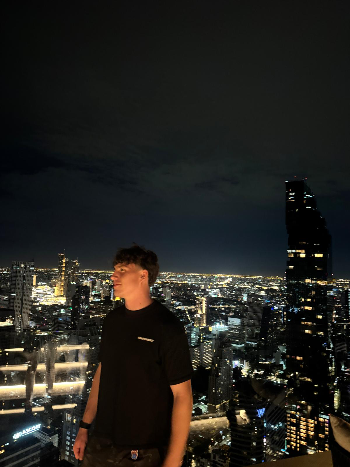 Marci overlooking the city skyline at night